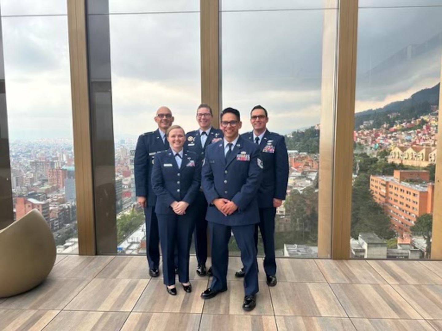 Photo of  Capt. Marissa Gaytan, 37th Training Wing and Tech. Sgt. Salvador Chavez, 837th Training Squadron, stand with Col. Lauren Courchaine, 37th Training Wing commander, and other U.S. Airmen during Cyber Wings 2022 in Bogotá,