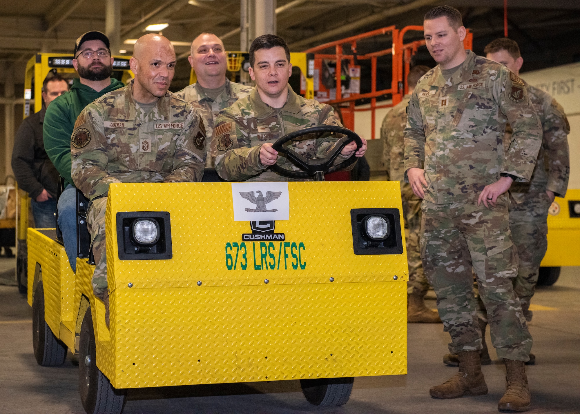 U.S. Air Force Col. David Wilson, Joint Base Elmendorf-Richardson and 673d Air Base Wing commander, drives through the entrance of a supply tunnel with Chief Master Sgt. Daniel Guzman, Joint Base Elmendorf-Richardson and 673d Air Base Wing command chief, at Joint Base Elmendorf-Richardson, Alaska, Feb. 3, 2023. The $5.2 million project was designed to ease the warehousing and distribution of assets between the 673d Logistics Readiness Group and the 673d Medical Group, providing the ability to transport supplies and equipment from one warehouse to another without delay. (U.S. Air Force photo by Airman 1st Class Moises Vasquez)