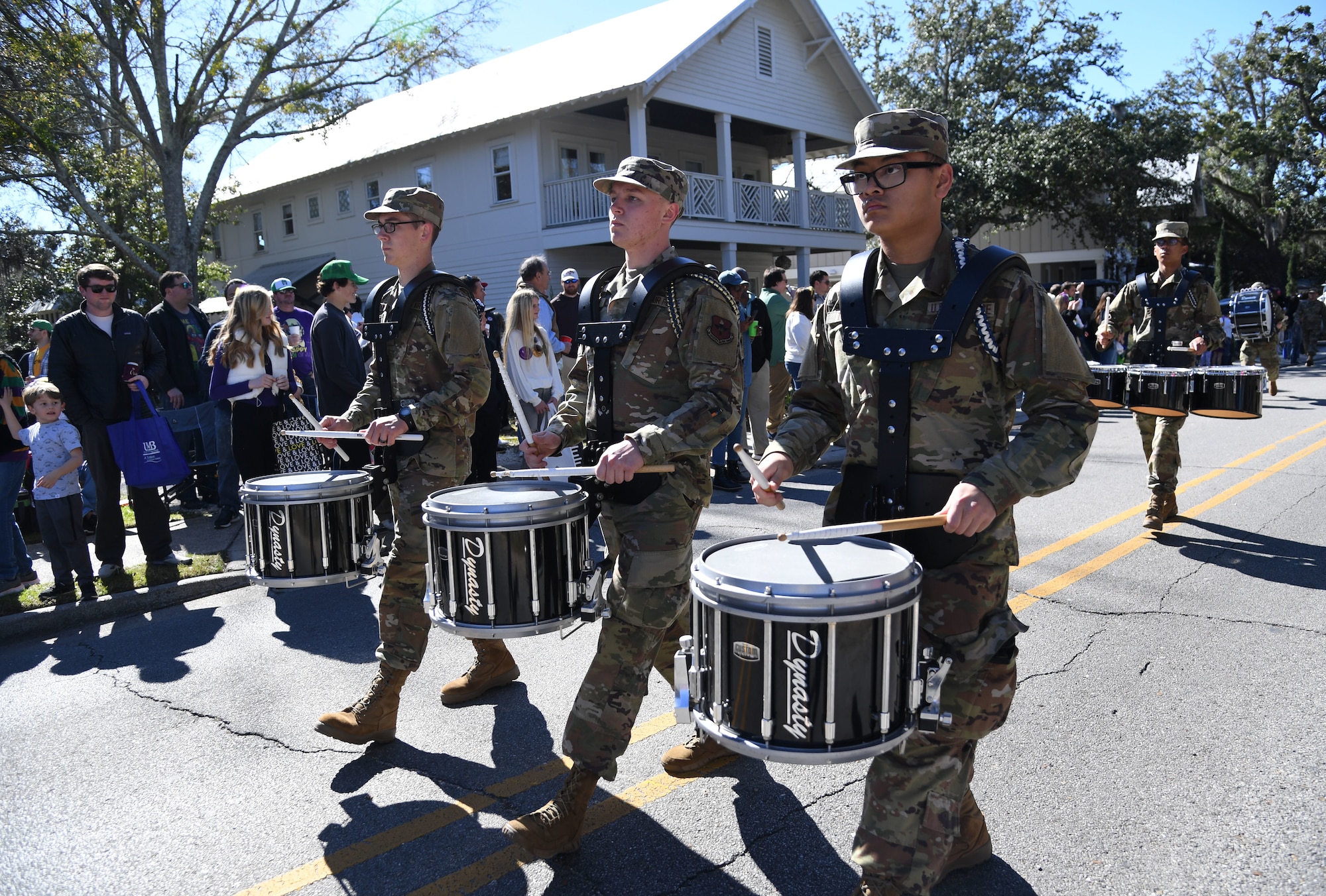 Members of the 81st Training Group Drum and Bugle Corps, Keesler Air Force Base, Mississippi, perform in the Ocean Springs Elks Mardi Gras Parade at Ocean Springs, Mississippi, Feb. 4, 2023.
