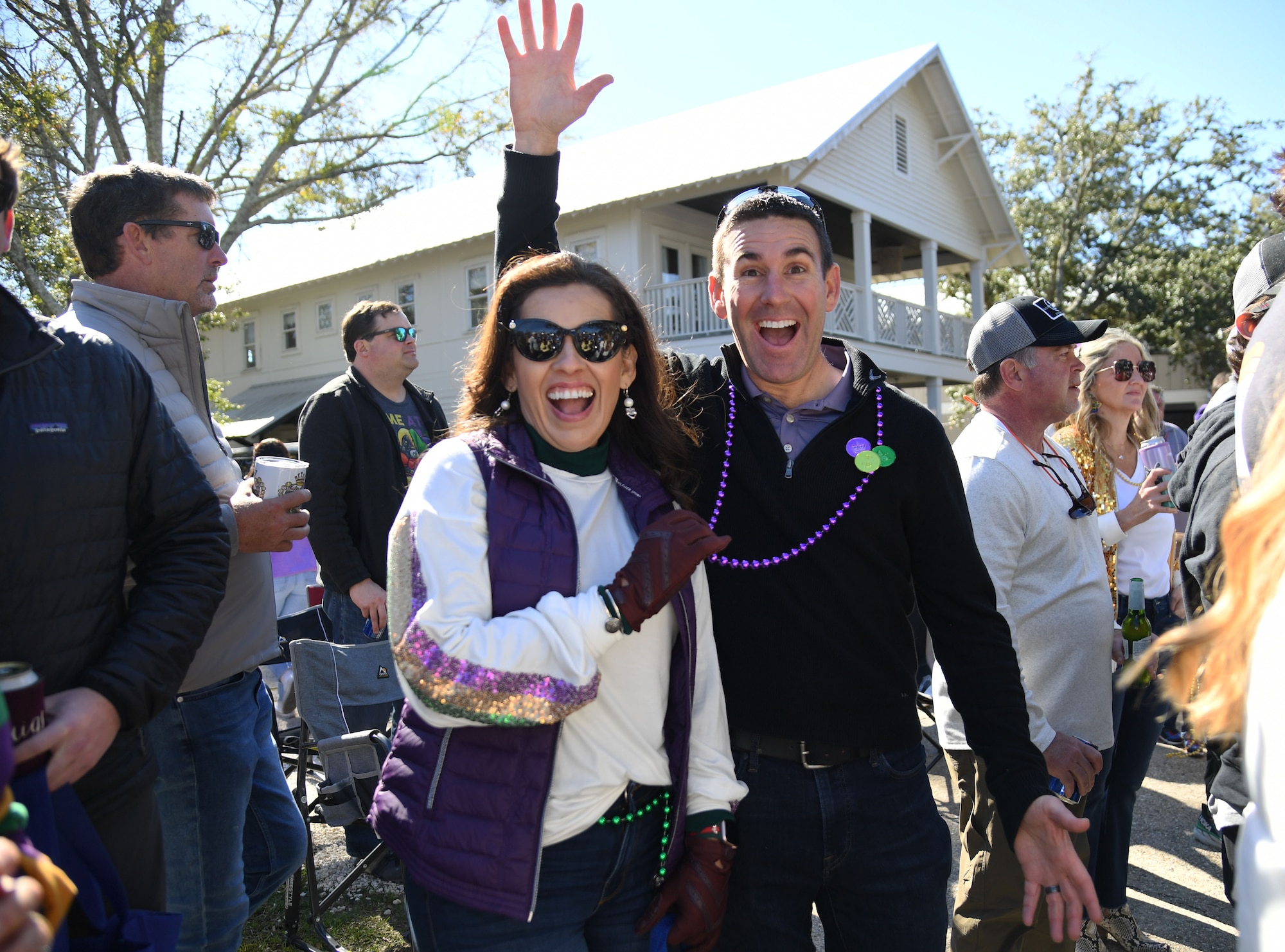 U.S. Air Force Col. Jason Allen, 81st Training Wing commander, and his wife, Mayra, pose for a photo during the Ocean Springs Elks Mardi Gras Parade at Ocean Springs, Mississippi, Feb. 4, 2023.