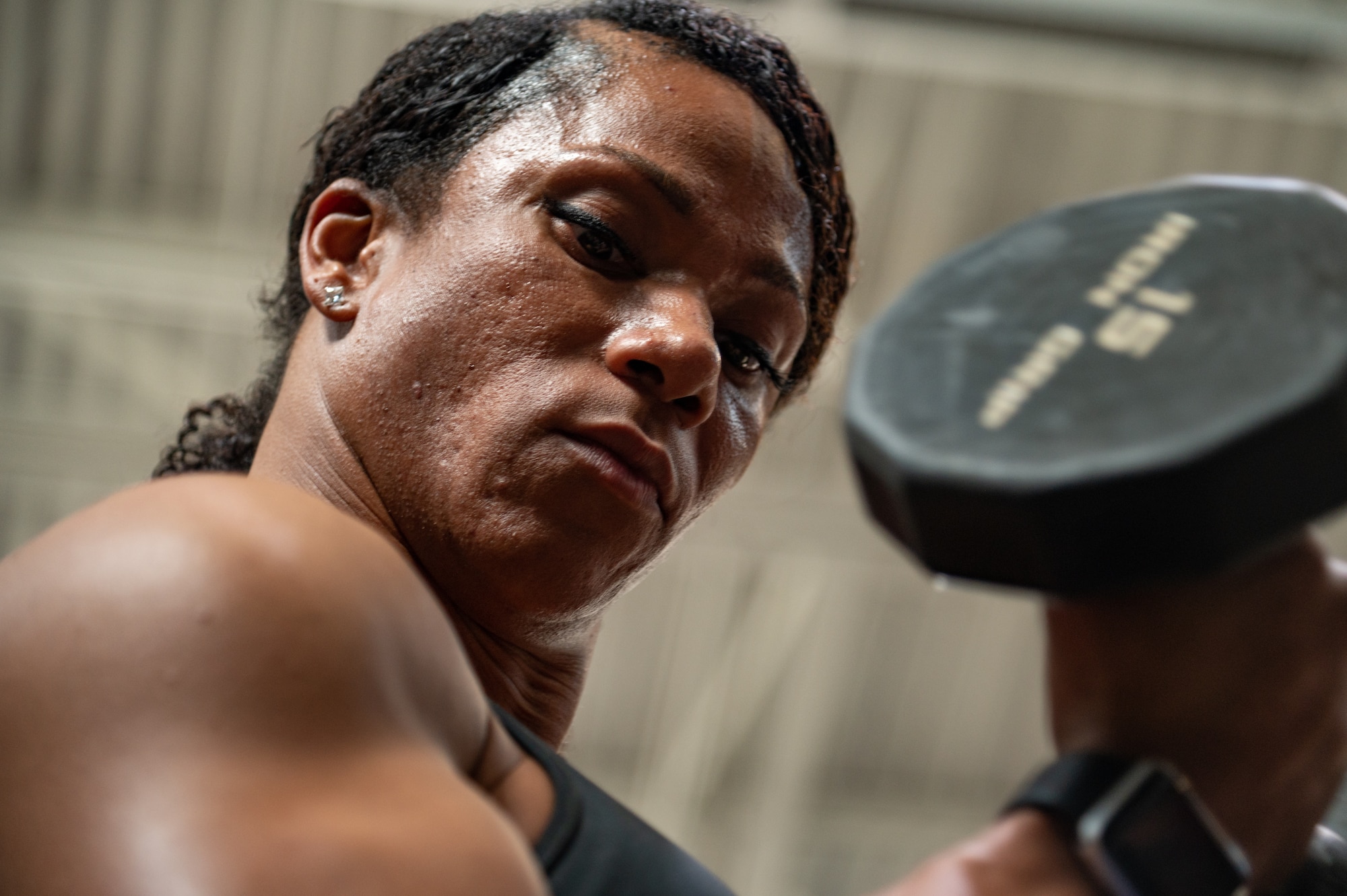 U.S. Air Force Tech. Sgt. Evon Pennington, a public health technician assigned to the 6th Medical Group, lifts a dumbbell at MacDill Air Force Base, Florida, Jan 31, 2023.