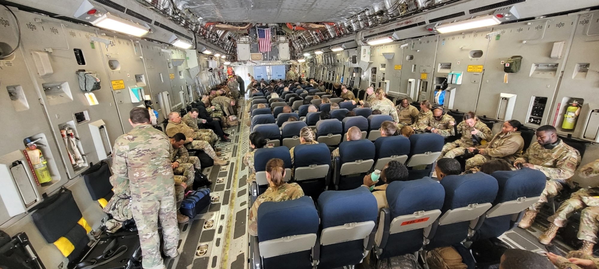 Reserve Citizen Airmen from the 932nd Airlift Wing, Scott Air Force Base, Illinois, board a C-17 Globemaster III on Feb. 6, 2023 in support of Operation Joint Endeavour training exercise.