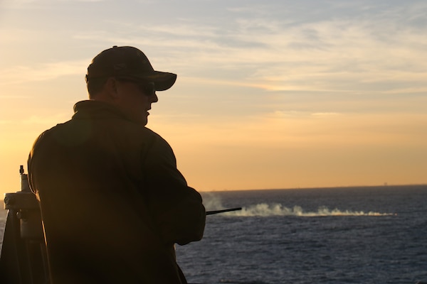 Cmdr. Brad A. Fancher, commanding officer of the dock landing ship USS Carter Hall (LSD 50), observes the debris field of a high-altitude surveillance balloon. Carter Hall is the lead ship in debris recovery efforts led by the Navy, in joint partnership with the U.S. Coast Guard, with multiple units in support of the effort, including ships, aircraft, and an Explosive Ordnance Disposal mobile diving and salvage unit. At the direction of the President of the United States and with the full support of the Government of Canada, U.S. fighter aircraft under U.S. Northern Command authority engaged and brought down a high altitude surveillance balloon within sovereign U.S. airspace and over U.S. territorial waters Feb. 4, 2023.  Active duty, Reserve, National Guard, and civilian personnel planned and executed the operation, and partners from the U.S. Coast Guard, Federal Aviation Administration, and Federal Bureau of Investigation ensured public safety throughout the operation and recovery efforts.