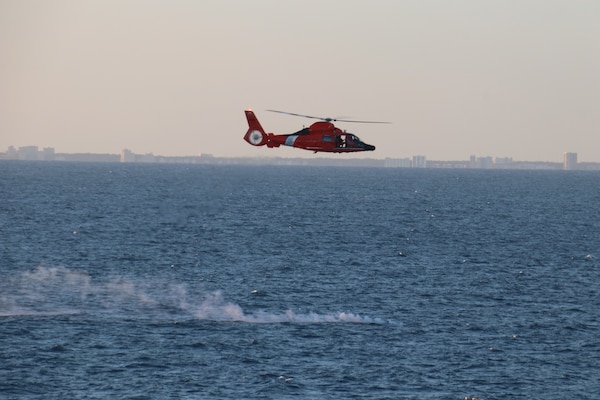 A U.S. Coast Guard helicopter flies over a debris field during recovery efforts of a high-altitude surveillance balloon. The Navy, in joint partnership with the U.S. Coast Guard, are providing multiple units in support of the effort, including ships, aircraft and an Explosive Ordnance Disposal mobile diving and salvage unit. At the direction of the President of the United States and with the full support of the Government of Canada, U.S. fighter aircraft under U.S. Northern Command authority engaged and brought down a high altitude surveillance balloon within sovereign U.S. airspace and over U.S. territorial waters Feb. 4, 2023.  Active duty, Reserve, National Guard, and civilian personnel planned and executed the operation, and partners from the U.S. Coast Guard, Federal Aviation Administration, and Federal Bureau of Investigation ensured public safety throughout the operation and recovery efforts.