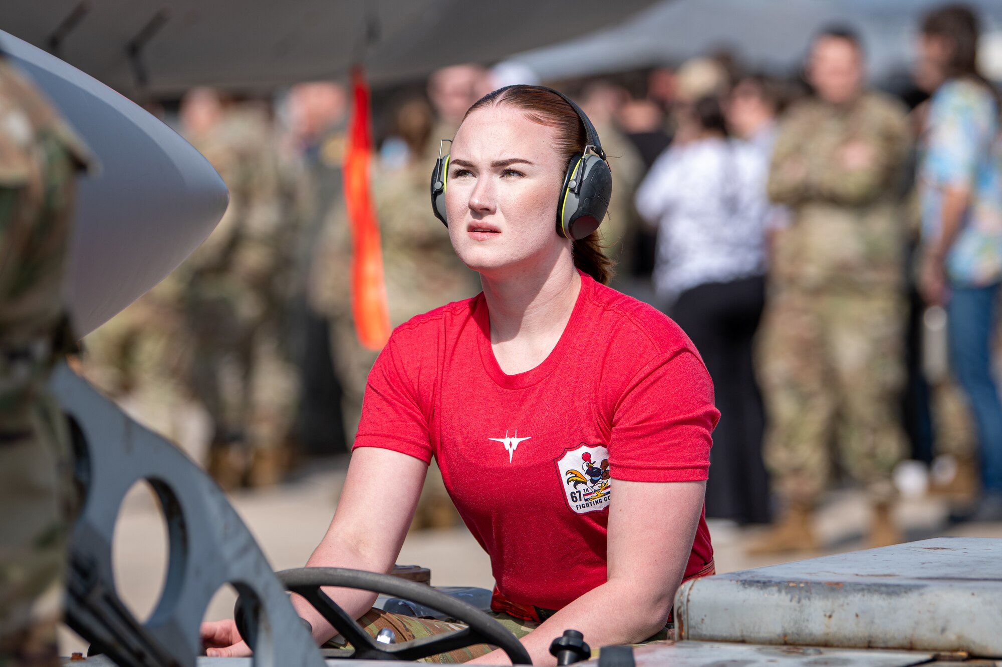 An Airman drives a bomb lift truck.