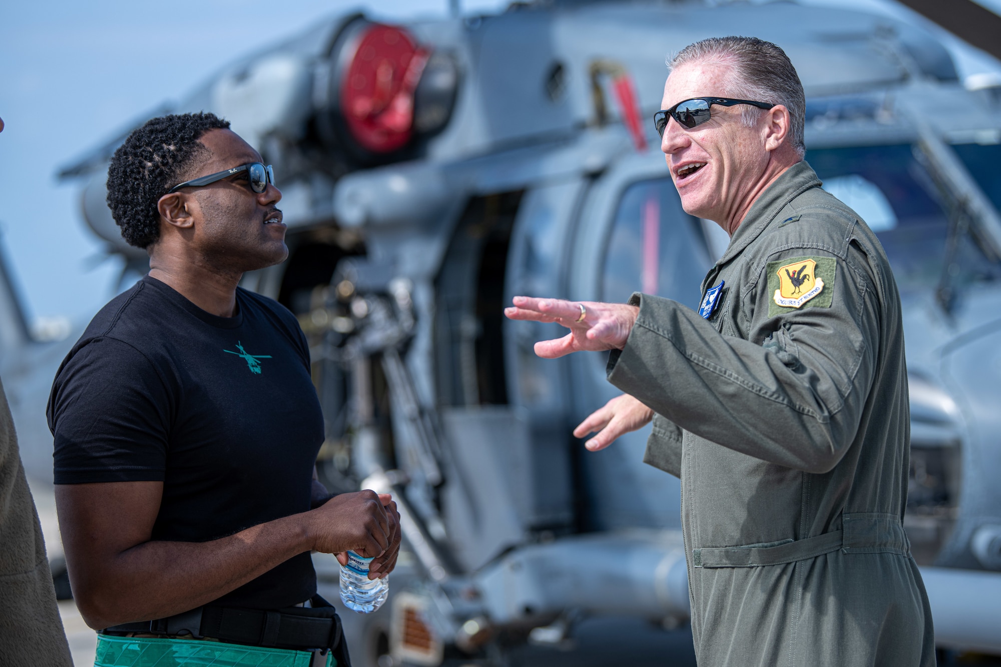 Airmen speak to each other.