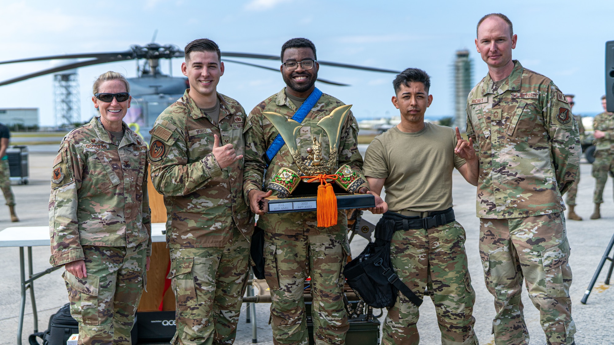 Airmen pose for a photo.