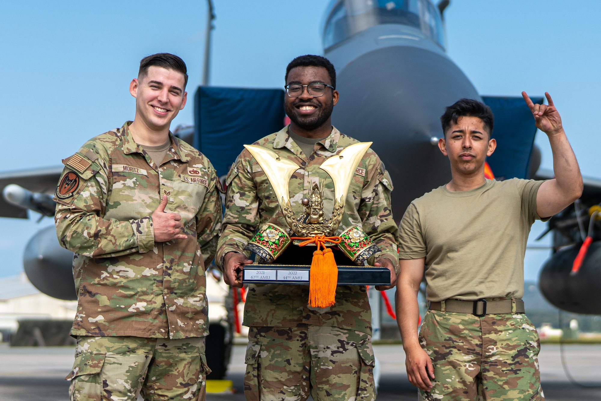 Airmen pose for a photo.