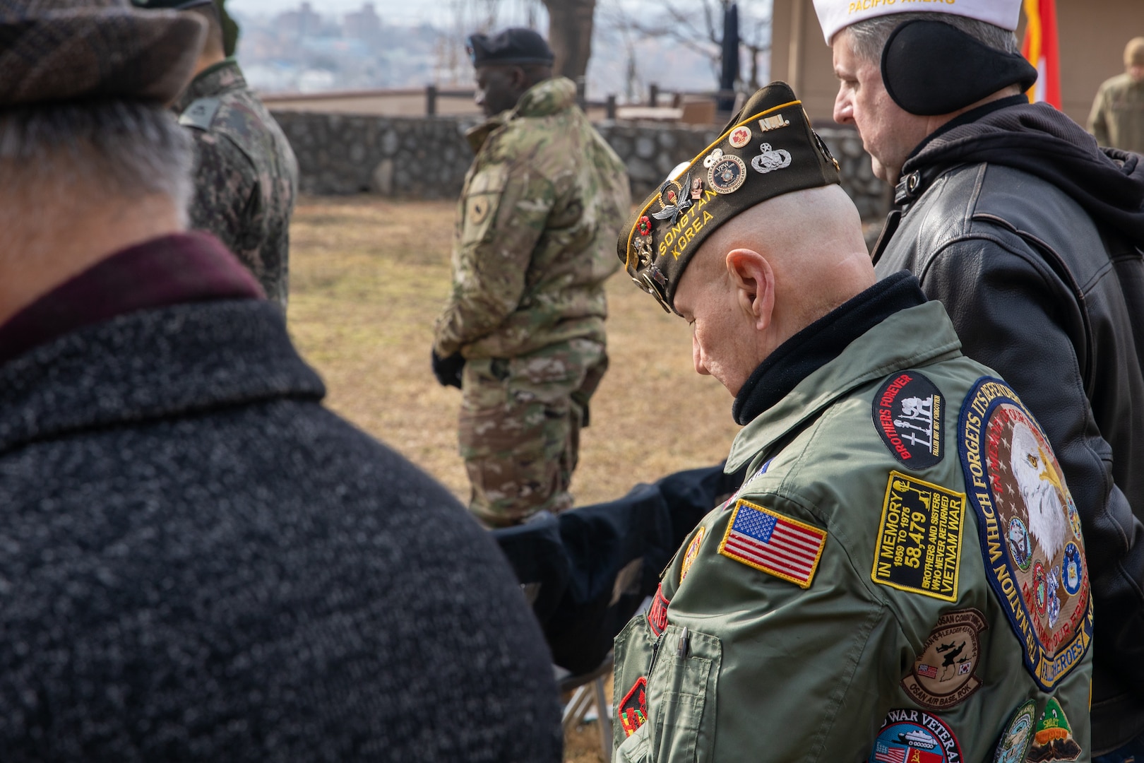 A member of the Veterans of Foreign Wars Cohort bows his head during the 72nd annual Battle of Hill 180 Ceremony at Osan Air Base, South Korea, Feb. 2, 2023.