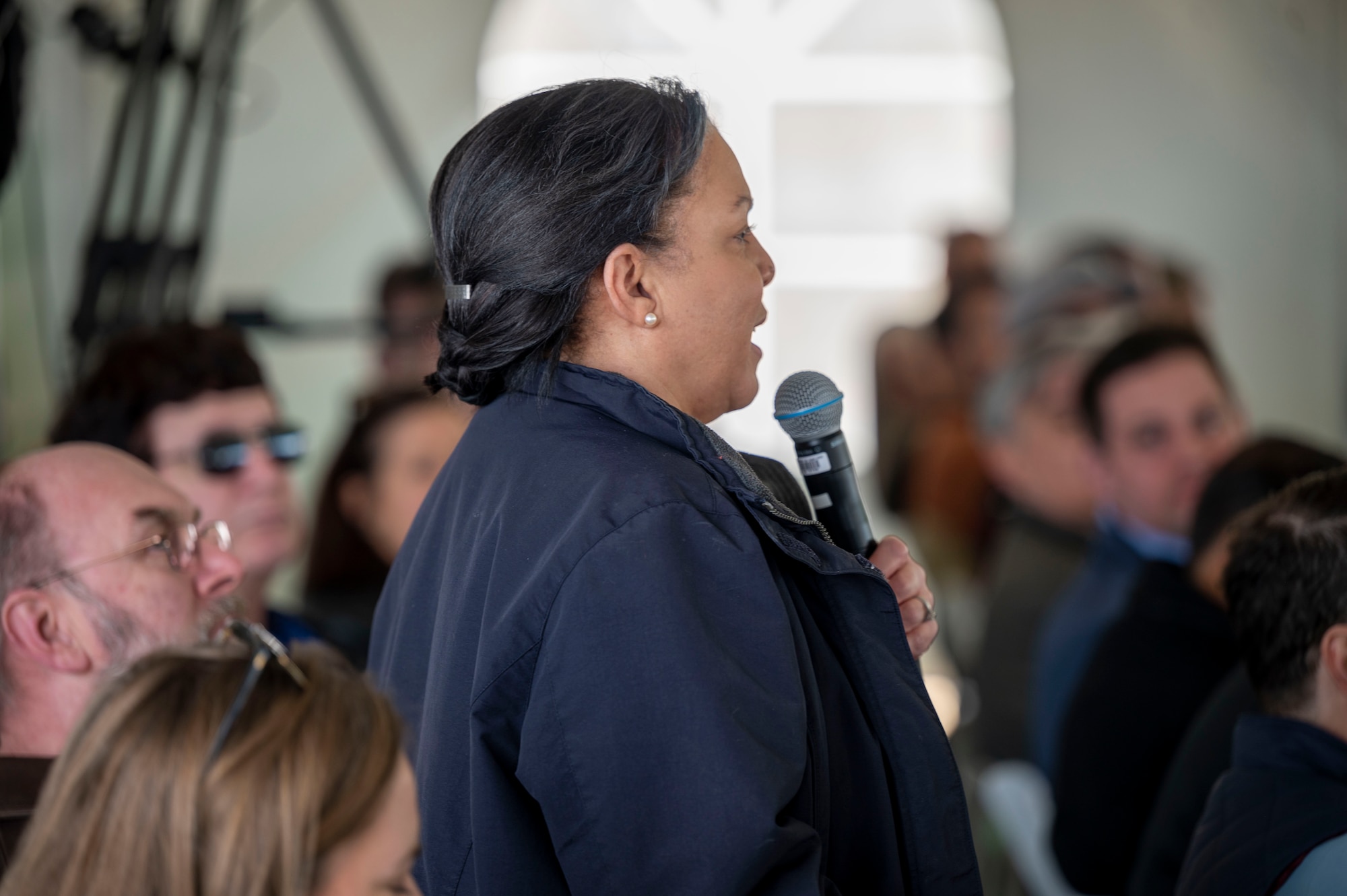 An Edwards Solar Enhanced Use Lease Project ribbon cutting ceremony attendee speaks about the cooperation between the contractors, U.S. Air Force, and local tribal nations to protect Native American cultural sites.