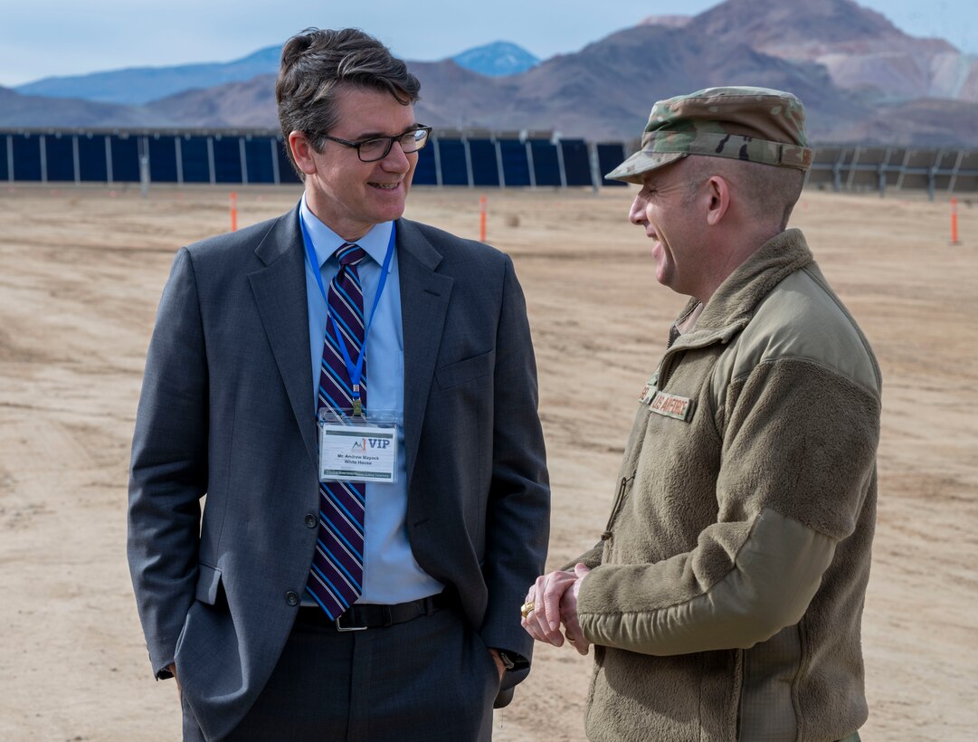 Andrew Mayock, Federal Chief Sustainability Officer, White House Council on Environmental Quality and Brig. Gen. Matthew Higer, Commander, 412th Test Wing speak at the Edwards Solar Enhanced Use Lease Project ribbon cutting ceremony commemorating the largest private-public collaboration in Department of Defense history at Edwards Air Force Base, California, Feb. 2.