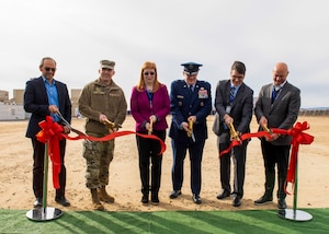 The ribbon is cut at the Edwards Solar Enhanced Use Lease Project ribbon cutting ceremony commemorating the largest private-public collaboration in Department of Defense history at Edwards Air Force Base, California, Feb. 2. (Pictured Left to Right: James R. Pagano, Chief Executive Officer, Terra-Gen LLC, Brig. Gen. Matthew Higer, Commander, 412th Test Wing, Nancy J. Balkus, Deputy Assistant Secretary of the Air Force, (Environment, Safety and Agriculture), Brig. Gen. William H. Kale III, Commander, Air Force Civil Engineer Center, Andrew Mayock, Federal Chief Sustainability Officer, White House Council on Environmental Quality and Daniel L. Johnson, Chief Executive Officer, Mortenson)