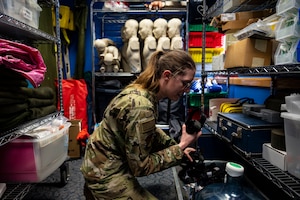 U.S. Air Force Tech. Sgt. Shelby Vande Zande, 49th Medical Group education and training flight chief, grabs equipment from a supply closet at Holloman Air Force Base, New Mexico, Jan. 27, 2023. The 49th MDG’s main goal in using the Medic-X program is implementing its training courses ensuring that both civilians and airmen working at the group can pitch in during dire situations. (U.S. Air Force photo by Airman 1st Class Isaiah Pedrazzini)