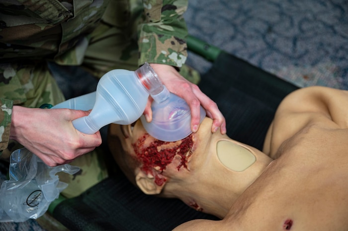 U.S. Air Force Tech. Sgt. Shelby Vande Zande, 49th Medical Group education and training flight chief, uses a resuscitation bag on a test dummy at Holloman Air Force Base, New Mexico, Jan. 27, 2023. Medic-X is a program implemented by the 49th MDG which trains its Airmen in skills such as measuring a patient’s IV intake, assessing a patient’s pain level and providing emergency airway management. (U.S. Air Force photo by Airman 1st Class Isaiah Pedrazzini)