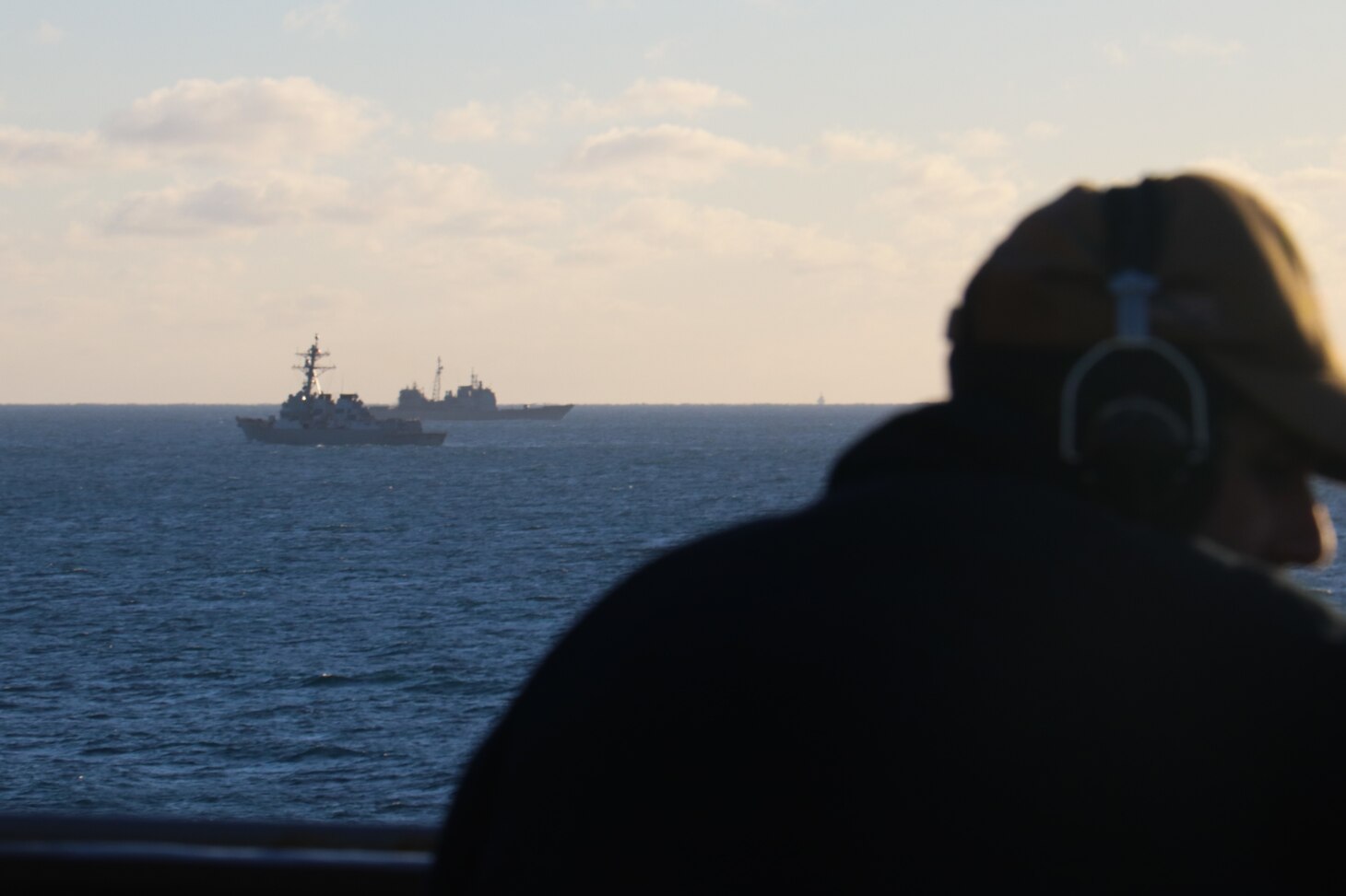 Seaman Rafael Mendez stands watch aboard the dock landing ship USS Carter Hall (LSD 50) while the guided-missile destroyer USS Oscar Austin (DDG 79) and the guided-missile cruiser USS Philippine Sea (CG 58) transit alongside debris from a high-altitude surveillance balloon. Carter Hall is the lead ship in debris recovery efforts led by the Navy, in joint partnership with the U.S. Coast Guard, with multiple units in support of the effort, including ships, aircraft, and an Explosive Ordnance Disposal mobile diving and salvage unit. At the direction of the President of the United States and with the full support of the Government of Canada, U.S. fighter aircraft under U.S. Northern Command authority engaged and brought down a high altitude surveillance balloon within sovereign U.S. airspace and over U.S. territorial waters Feb. 4, 2023. Active duty, Reserve, National Guard, and civilian personnel planned and executed the operation, and partners from the U.S. Coast Guard, Federal Aviation Administration, and Federal Bureau of Investigation ensured public safety throughout the operation and recovery efforts.