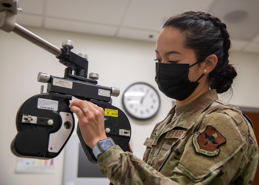 Airman 1st Class Samantha Sim, 59th Surgical Operations Squadron ophthalmic technician, sanitizes a phoropter prior to refracting a patient at the Ophthalmology Clinic in Wilford Hall Ambulatory Surgical Center, Joint Base San Antonio-Lackland, Jan. 19, 2023. The 59th SGC tests and treats to prevent vision loss, promote a better quality of life and support a worldwide qualified force. (U.S. Air Force photo by Senior Airman Melody Bordeaux)