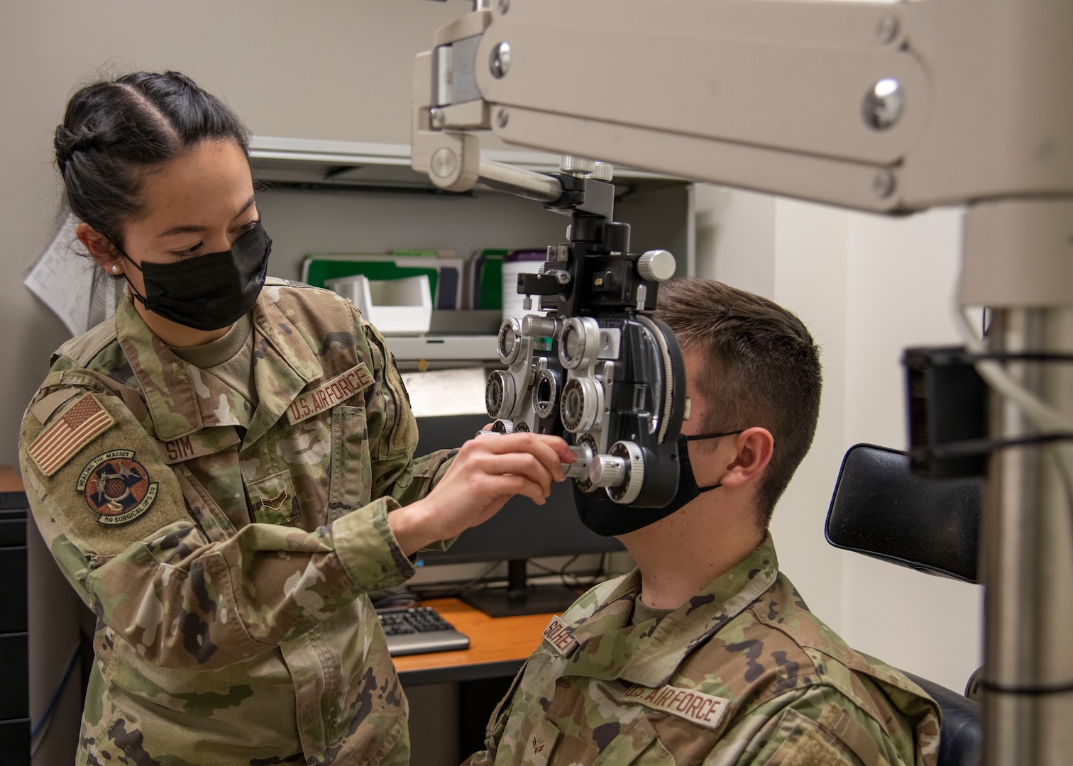 Airman 1st Class Samantha Sim, 59th Surgical Operations Squadron ophthalmic technician, refracts a patient’s eyes at the Ophthalmology Clinic in Wilford Hall Ambulatory Surgical Center, Joint Base San Antonio-Lackland, Jan. 19, 2023. The 59th SGC tests and treats to prevent vision loss, promote a better quality of life and support a worldwide qualified force. (U.S. Air Force photo by Senior Airman Melody Bordeaux)