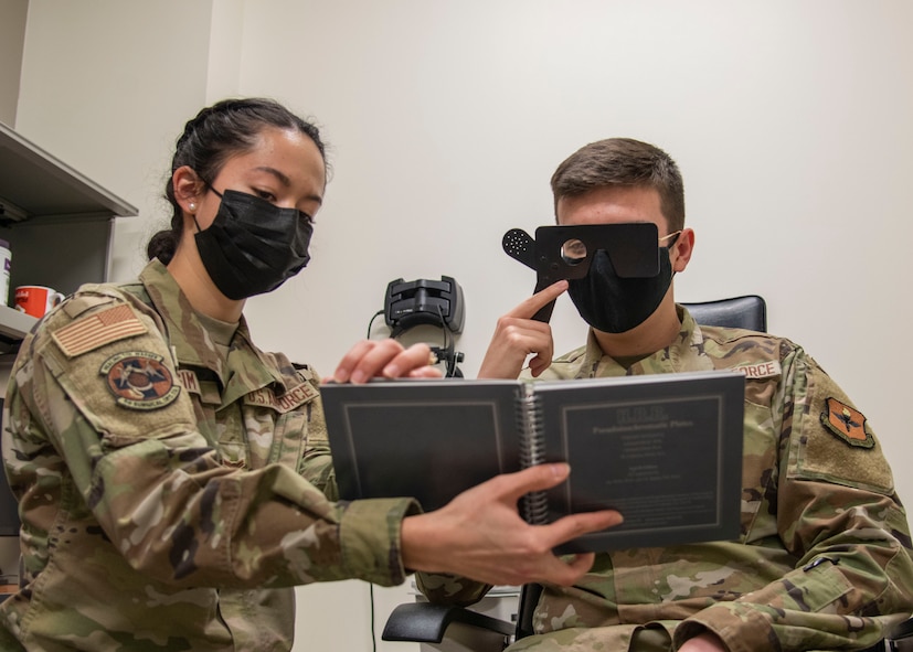 Airman 1st Class Samantha Sim, 59th Surgical Operations Squadron ophthalmic technician, tests a patient for color deficiencies at the Ophthalmology Clinic in Wilford Hall Ambulatory Surgical Center, Joint Base San Antonio-Lackland, Jan. 19, 2023. The 59th SGC tests and treats to prevent vision loss, promote a better quality of life and support a worldwide qualified force. (U.S. Air Force photo by Senior Airman Melody Bordeaux)