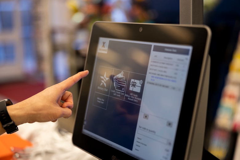 A customer uses a recently installed self-checkout station at the Foster Exchange on Camp Foster, Okinawa, Japan, Jan. 4, 2023. The Foster Exchange has implemented the Buy Online, Pick Up in Store program and self-checkout stations to enhance the shopping experience. The staff implemented these programs upon customer request for contactless and efficient shopping. (U.S. Marine Corps photo by Lance Cpl. Thomas Sheng)