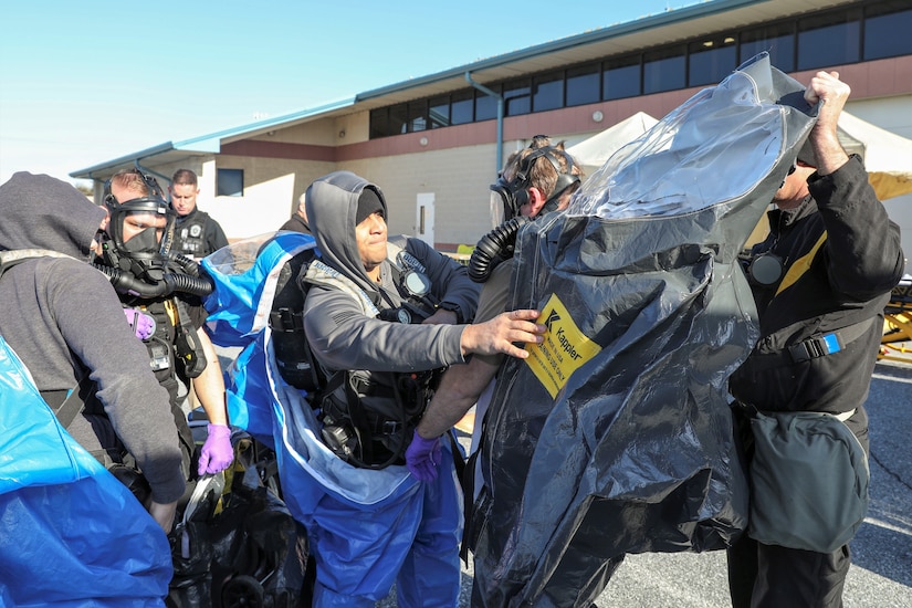 U.S. Army Soldiers with the Pennsylvania National Guard’s 3rd Weapons of Mass Destruction Civil Support Team train in preparation for an upcoming external evaluation Feb. 2 at Sysco of Central Pa. in Harrisburg, Pa. The 22 Soldiers simulated being called upon by civilian authorities to investigate and respond to potential drug production laboratories. Sgt. Kyle Clark and Sgt. Kevin Dodson don hazardous material suits before entering a building to investigate potential simulated drug production laboratories. (U.S. Army National Guard photo by Sgt. 1st Class Zane Craig)