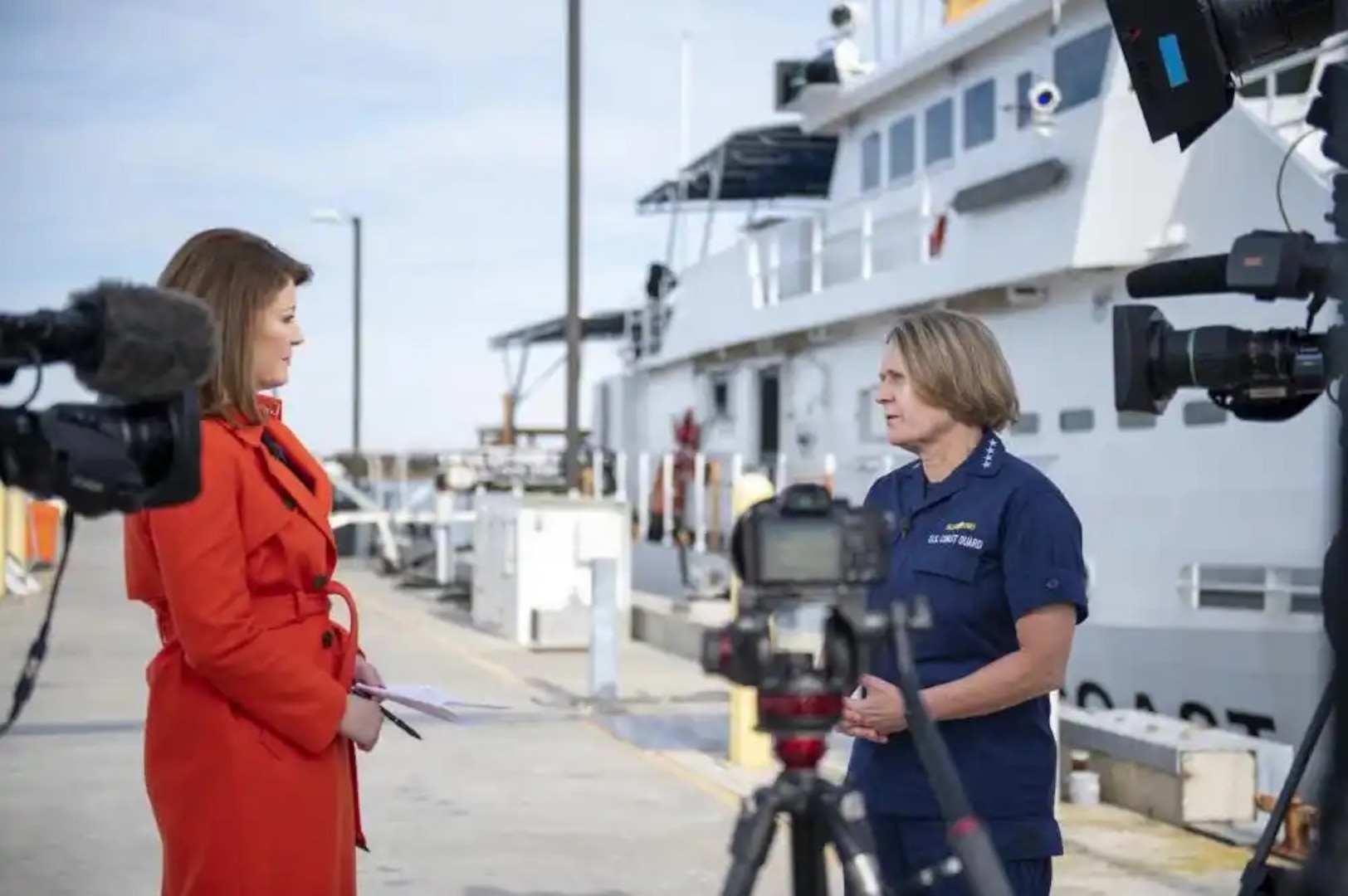 Coast Guard Adm. Linda Fagan, commandant of the U.S. Coast Guard, conducts an on-camera interview with Nora O'Donnell, CBS news anchor, on the cutter pier at U.S. Coast Guard Training Center Cape May, N.J., Nov. 29, 2022. During the interview, Fagan and O'Donnell discussed the Coast Guard's missions, people, and recruiting efforts. (U.S. Coast Guard photo by Petty Officer 2nd Class Shannon Kearney)