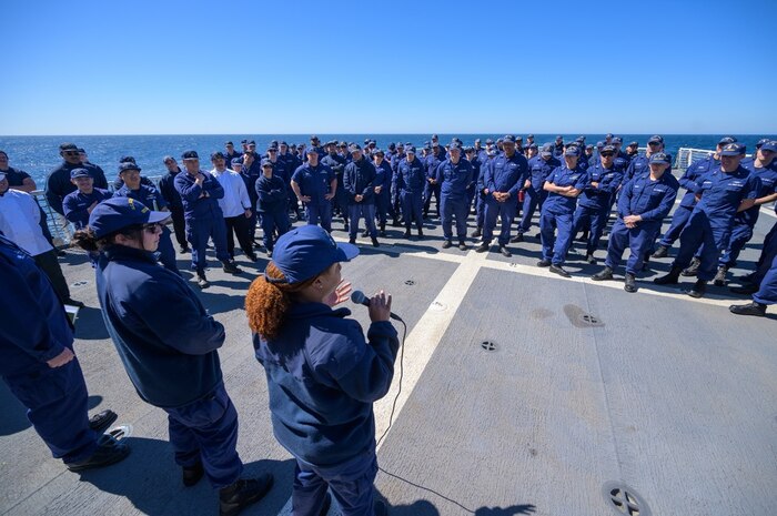 Crewmembers of the Coast Guard Cutter Munro assemble to hear pass down information from the cutter’s command. USCG photo.