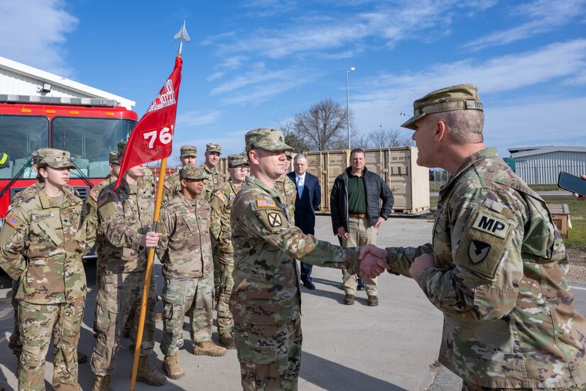 Soldiers of the ASA-Black Sea fire department stand in front of the fire station at MK Air Base with IMCOM leadership on 20 January, 2023.