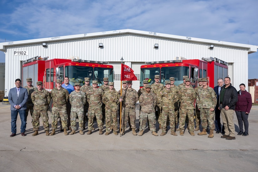 Soldiers of the ASA-Black Sea fire department stand in front of the fire station at MK Air Base with IMCOM leadership on 20 January, 2023.