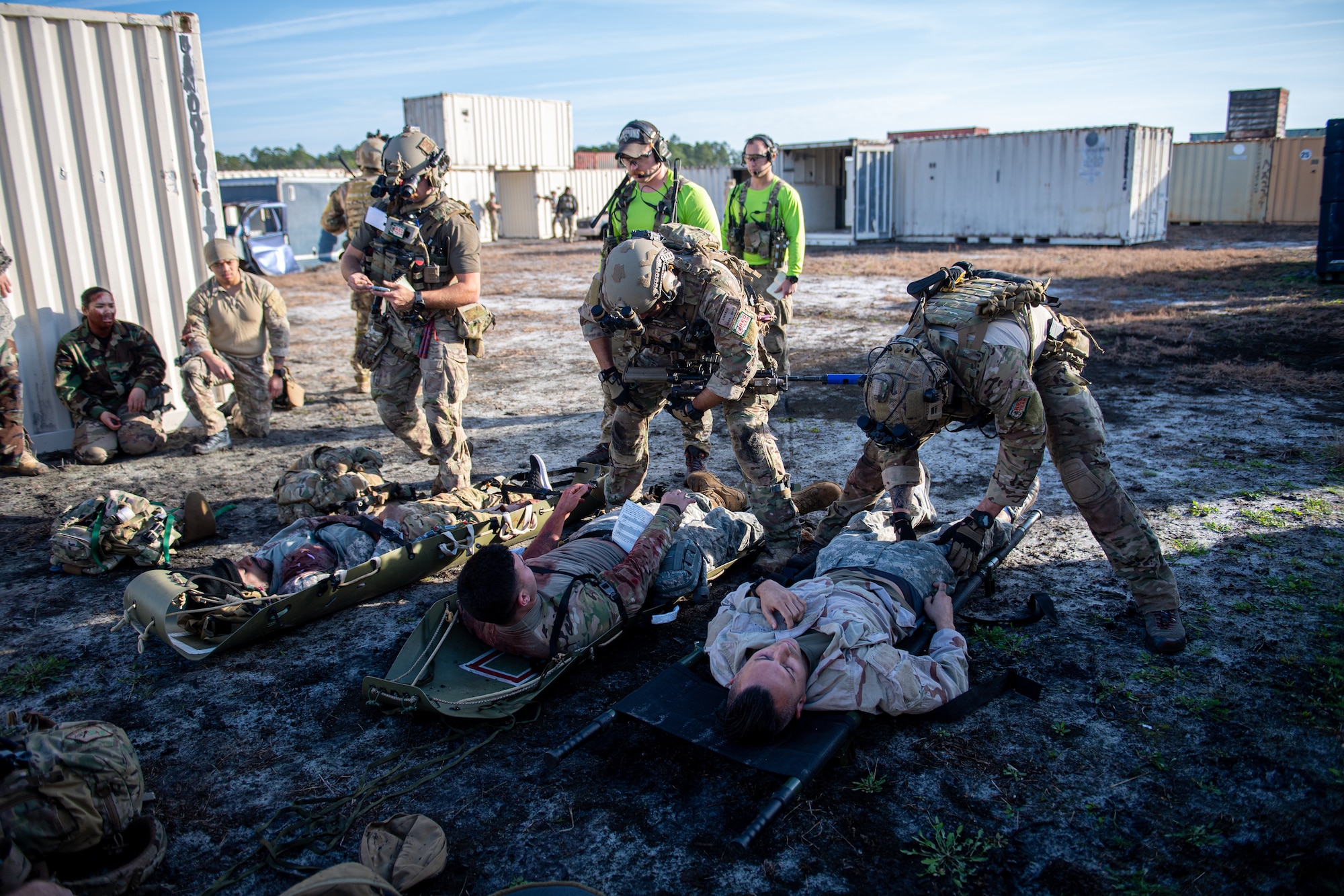 A photo of Airmen helping simulated injured patients.