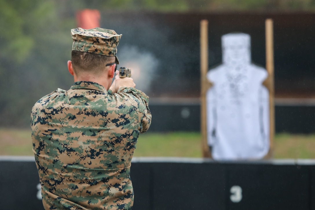 A U.S. Marine with the School of Infantry-East, Combat Instructor School, fires at targets while conducting pistol qualification at Camp Lejeune, N.C., Feb 1, 2023. Pistol qualification is a requirement for students at the Combat Instructor School.
