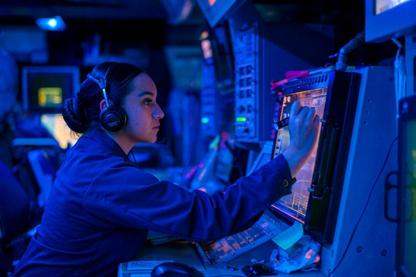 A Navy Petty Officer stands watch in the combat information center.