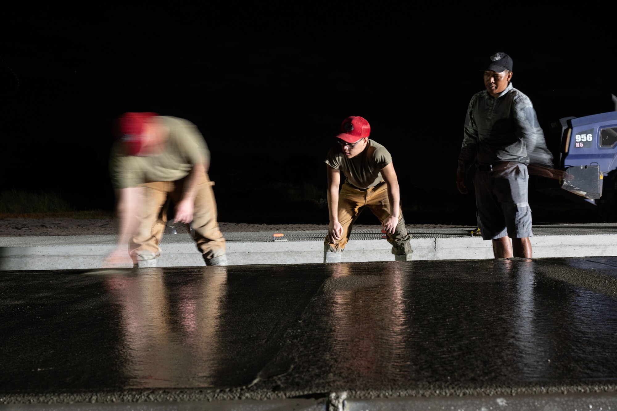 Senior Airman Arthur Hettinger, 819th RED HORSE Squadron Pavements and Equipment operator, shows Airman First Class Andres Baez and a Philippine Air Force member the process of edging concrete during a Field Training Event at Basa Air Base, Philippines, January 25, 2023. Events like this show the U.S. Air Force’s commitment to improving the defensive capabilities of its Allies and partners, and international Airmen are the backbone of those military-to-military partnerships. (U.S. Air Force photo by Tech. Sgt. Hailey Haux)