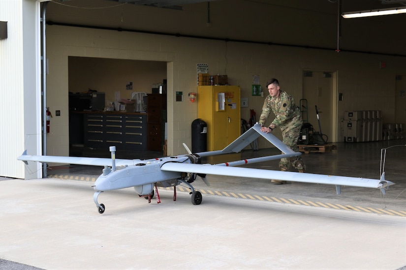 U.S. Army Warrant Officer Adam Rocker, a UAS operator with Delta Company, 876th Brigade Engineer Battalion, 2nd Infantry Brigade Combat Team, 28th Infantry Division, prepares an RQ-7 Shadow for flight at the Unmanned Aircraft System Operations Facility at Fort Indiantown Gap, Jan. 30, 2023. (U.S. Army National Guard photo by Capt. Travis Mueller)