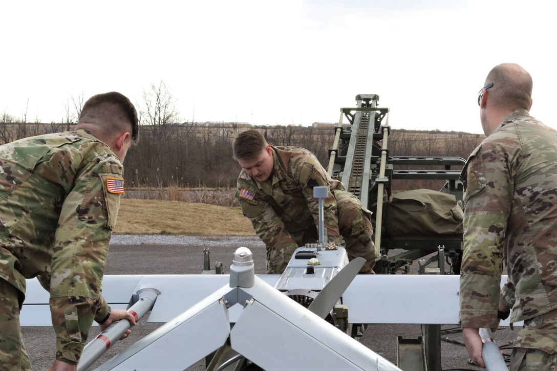 U.S. Soldiers with the 28th Infantry Division prepare an RQ-7 Shadow for flight at the Unmanned Aircraft System Operations Facility at Fort Indiantown Gap, Jan. 30, 2023. (U.S. Army National Guard photo by Capt. Travis Mueller)