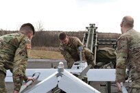 U.S. Soldiers with the 28th Infantry Division prepare an RQ-7 Shadow for flight at the Unmanned Aircraft System Operations Facility at Fort Indiantown Gap, Jan. 30, 2023. (U.S. Army National Guard photo by Capt. Travis Mueller)