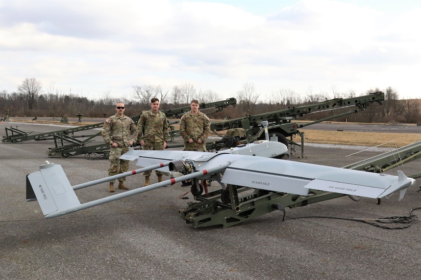 From left, U.S. Army Chief Warrant Officer 2 Nathan Shea, Warrant Officer Adam Rocker and Spc. Tucker Goschinski, UAS operators with the 28th Infantry Division prepare an RQ-7 Shadow for flight at the Unmanned Aircraft System Operations Facility at Fort Indiantown Gap, Jan. 30, 2023. (U.S. Army National Guard photo by Capt. Travis Mueller)