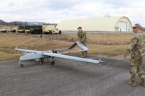 U.S. Army Warrant Officer Adam Rocker, a UAS operator with Delta Company, 876th Brigade Engineer Battalion, 2nd Infantry Brigade Combat Team, 28th Infantry Division, prepares an RQ-7 Shadow for flight at the Unmanned Aircraft System Operations Facility at Fort Indiantown Gap, Jan. 30, 2023. (U.S. Army National Guard photo by Capt. Travis Mueller)