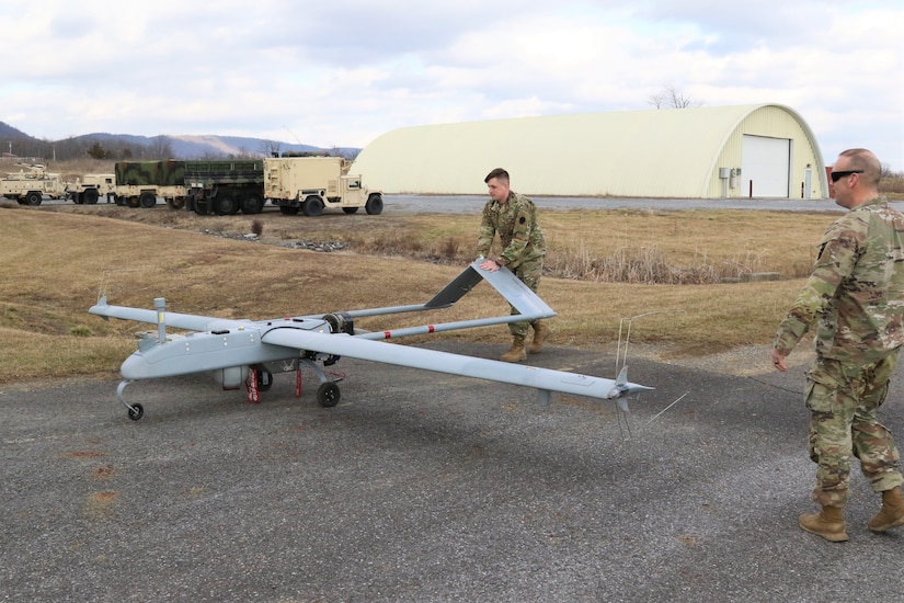 U.S. Army Warrant Officer Adam Rocker, a UAS operator with Delta Company, 876th Brigade Engineer Battalion, 2nd Infantry Brigade Combat Team, 28th Infantry Division, prepares an RQ-7 Shadow for flight at the Unmanned Aircraft System Operations Facility at Fort Indiantown Gap, Jan. 30, 2023. (U.S. Army National Guard photo by Capt. Travis Mueller)