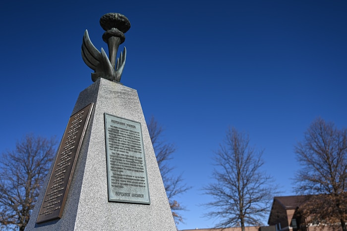 The 509th Bomb Wing monument sits in front of the 509th Bomb Wing building on Whiteman Air Force Base, Mo. on February 7, 2023. The monument symbolizes the history of the 509th Bomb Wing.  (U.S. Air Force photo by Airman First Class Bryson Britt)