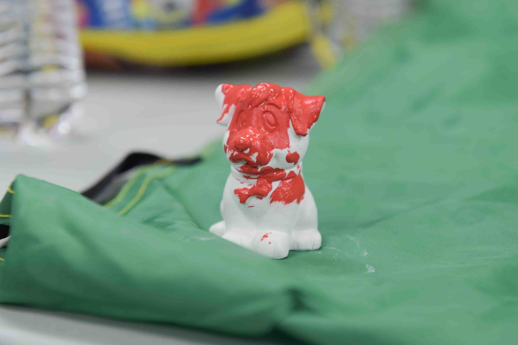 A photo of a ceramic puppy.