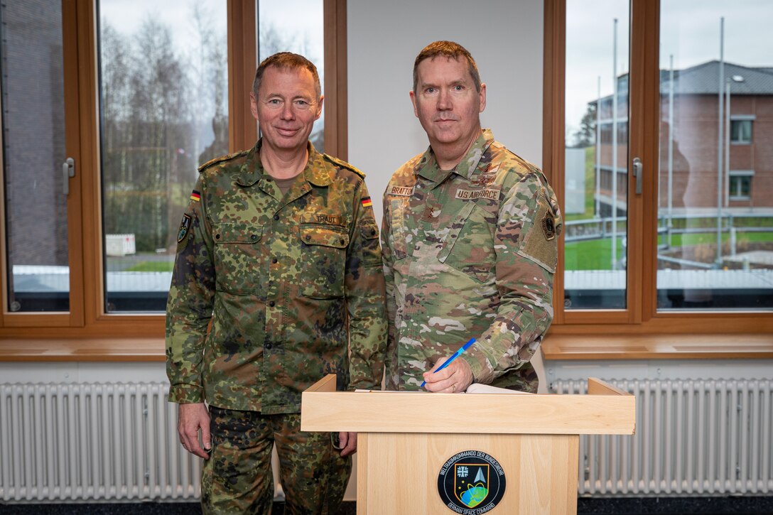 Maj. Gen. Shawn Bratton, commander of Space Training and Readiness Command, right, poses for a photo with German Maj. Gen. Michael Traut, commander of German Space Command, during a visit to the German Space Situational Awareness Centre in Uedem, Germany