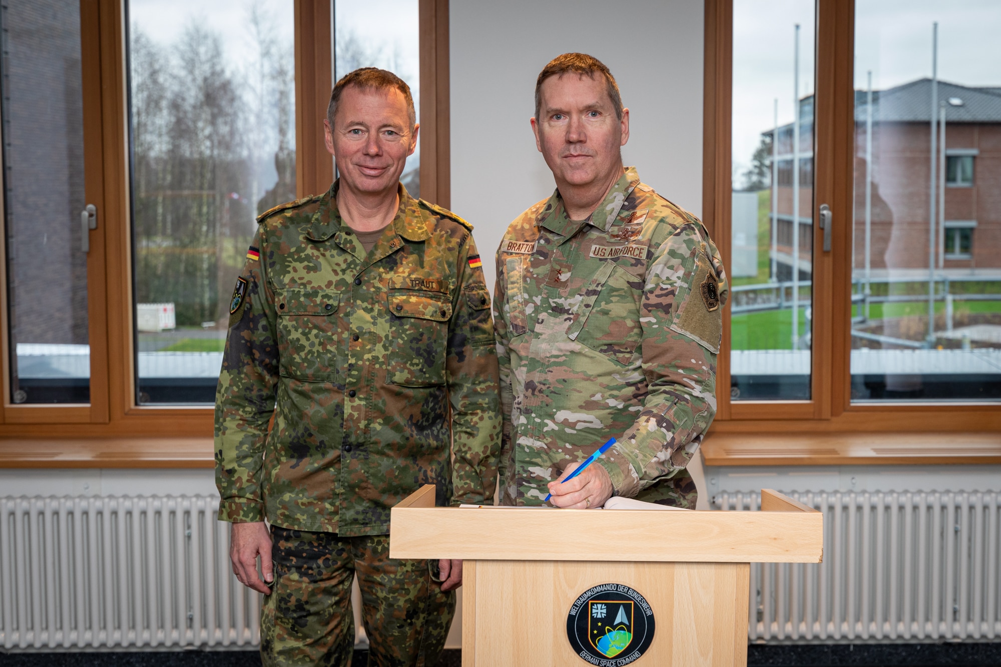 Maj. Gen. Shawn Bratton, commander of Space Training and Readiness Command, right, poses for a photo with German Maj. Gen. Michael Traut, commander of German Space Command, during a visit to the German Space Situational Awareness Centre in Uedem, Germany