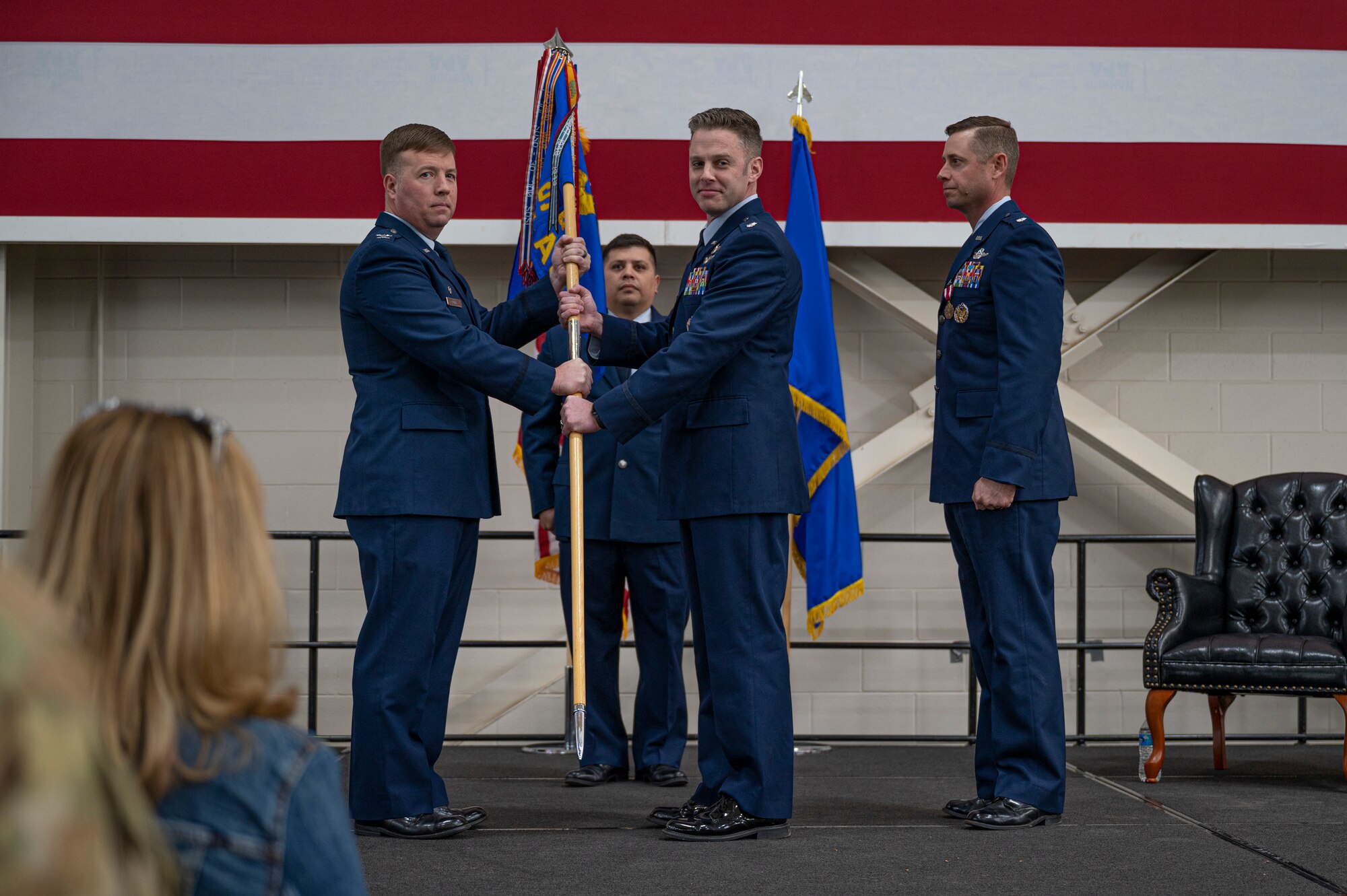 Col. John Poole, 317th Operations Group commander, hands the guidon to Lt. Col. Sean Stumpf, incoming 40th Airlift Squadron commander, during the 40th AS change of command ceremony at Dyess Air Force Base, Texas, Feb. 3, 2023. The 40th AS supports theater commanders' requirements with combat-delivery capability through tactical airland and airdrop operations as well as humanitarian efforts and aeromedical evacuation. (U.S. Air Force photo by Senior Airman Colin Hollowell)