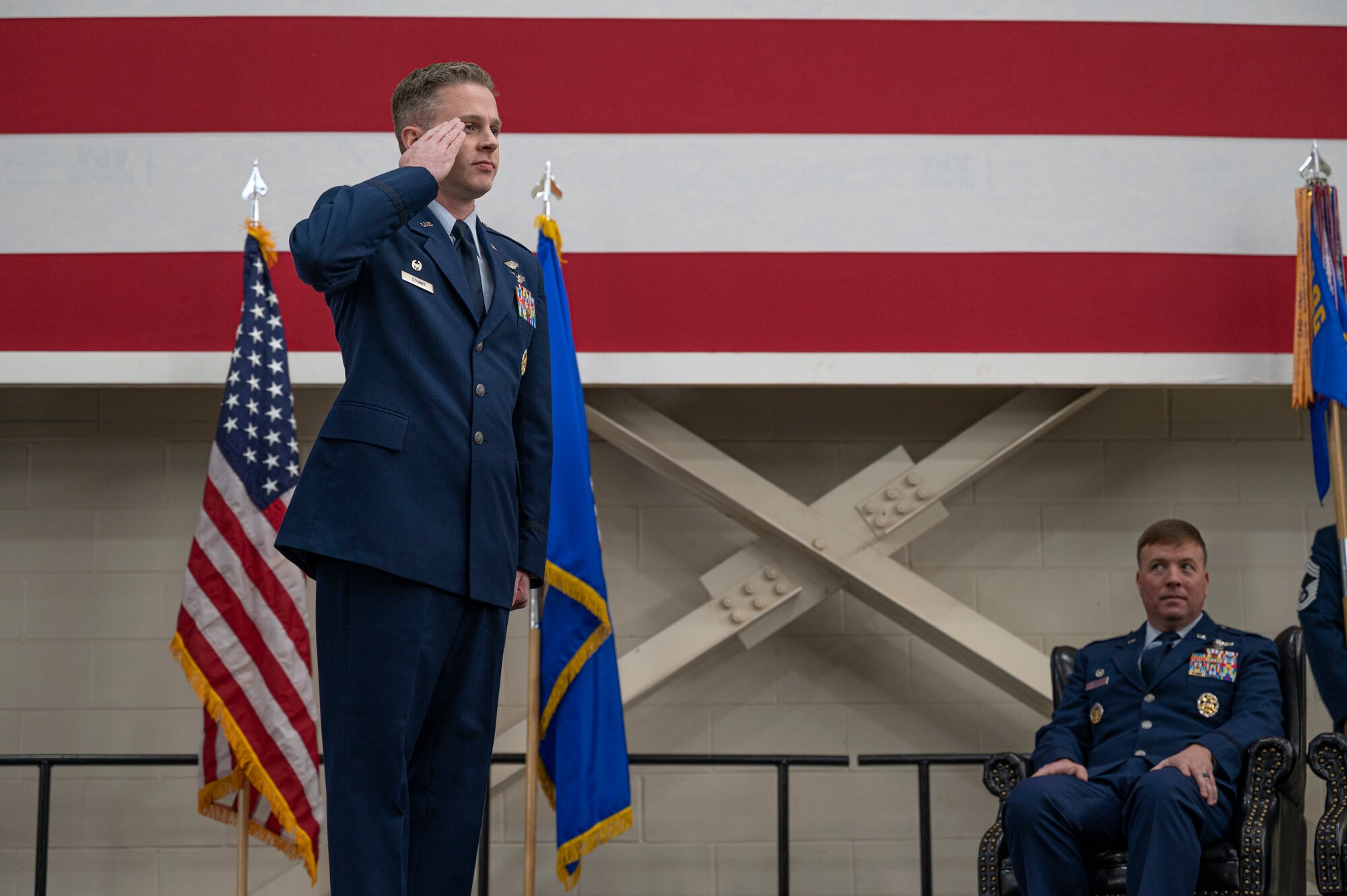 Lt. Col. Sean Stumpf, incoming 40th Airlift Squadron commander, renders his first salute to the 40th AS Airmen following the change of command ceremony at Dyess Air Force Base, Texas, Feb. 3, 2023. The 40th AS supports theater commanders' requirements with combat-delivery capability through tactical airland and airdrop operations as well as humanitarian efforts and aeromedical evacuation. (U.S. Air Force photo by Senior Airman Colin Hollowell)