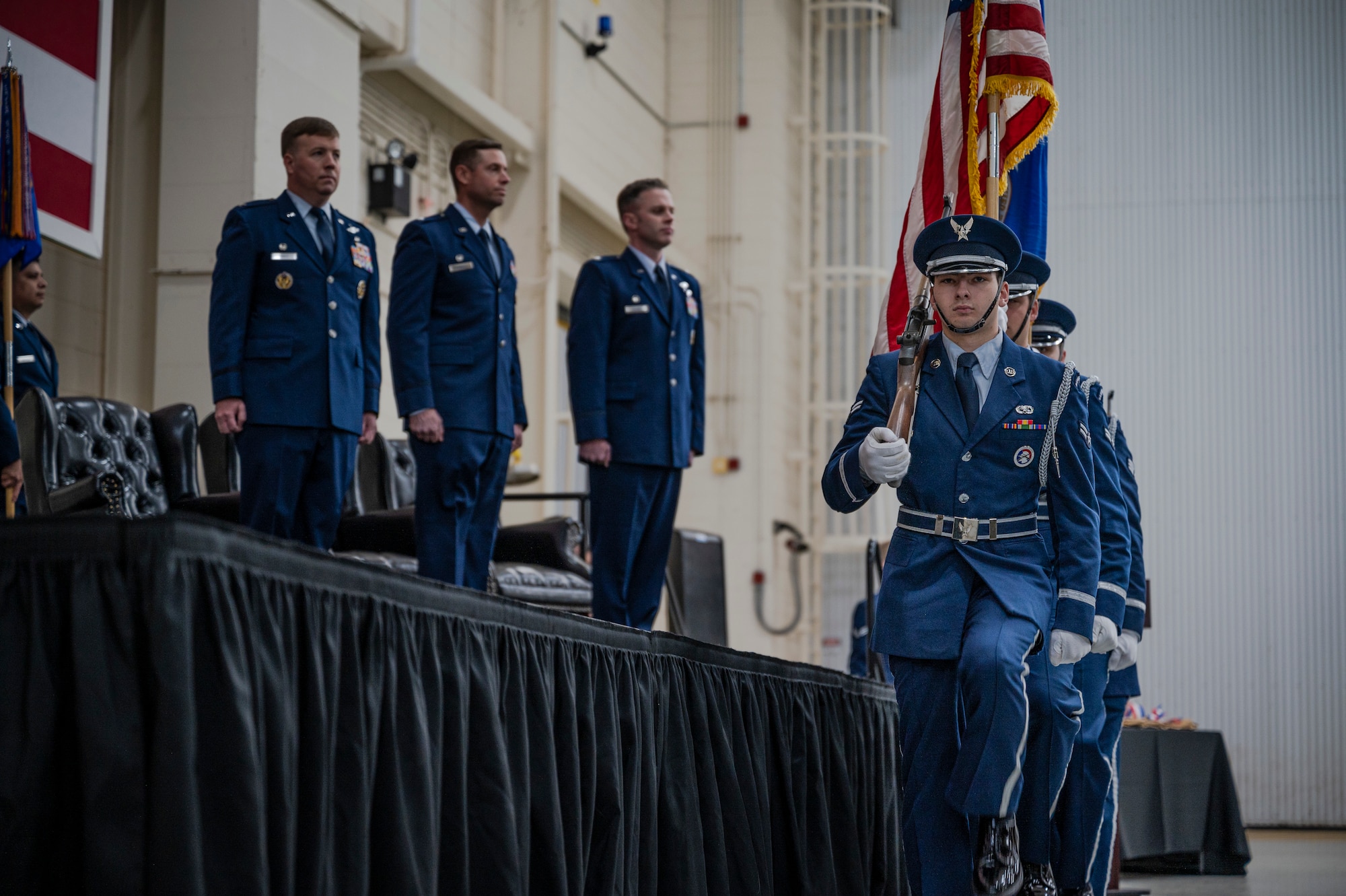 Dyess honor guardsmen post the colors during the 40th Airlift Squadron change of command ceremony at Dyess Air Force Base, Texas, Feb. 3, 2023. The 40th AS supports theater commanders' requirements with combat-delivery capability through tactical airland and airdrop operations as well as humanitarian efforts and aeromedical evacuation. (U.S. Air Force photo by Senior Airman Colin Hollowell)