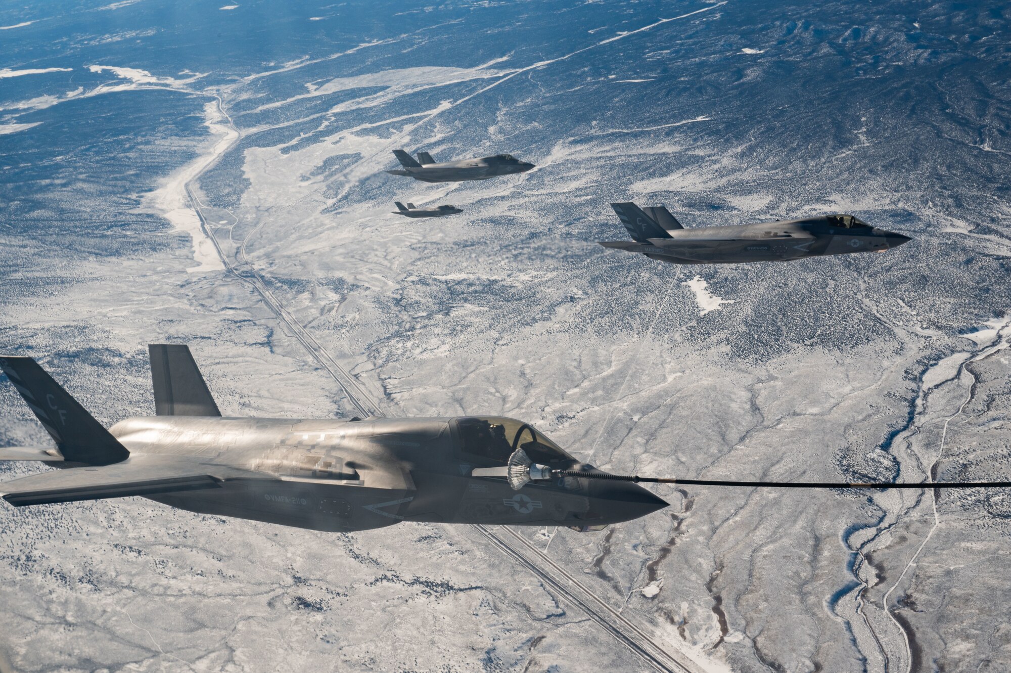 Three U.S. Marine Corps F-35Bs from Marine Fighter Attack Squadron-211 await refueling from a Royal Air Force Voyager in participation of Red Flag-Nellis 23-1 over the Nevada Test and Training Range, Jan. 26, 2023.