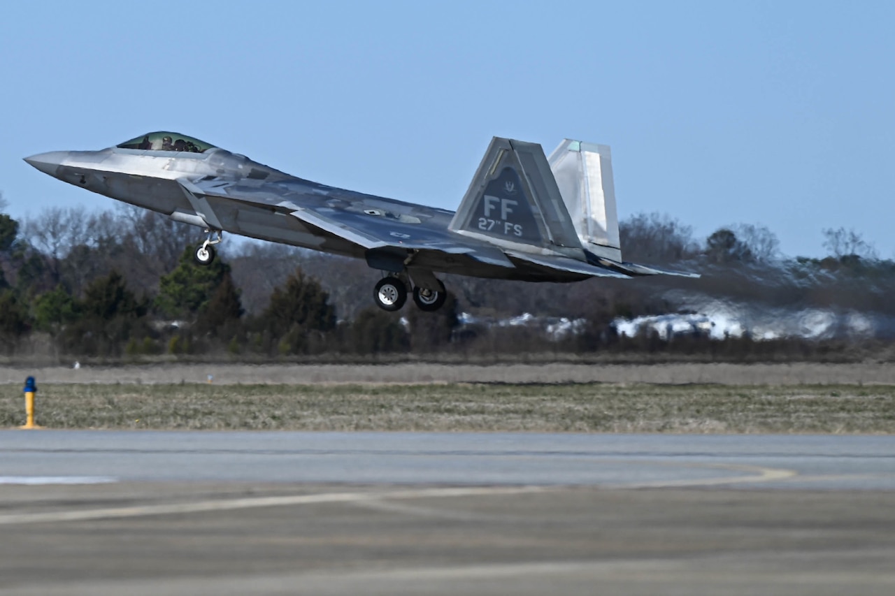 A fighter jet takes off.