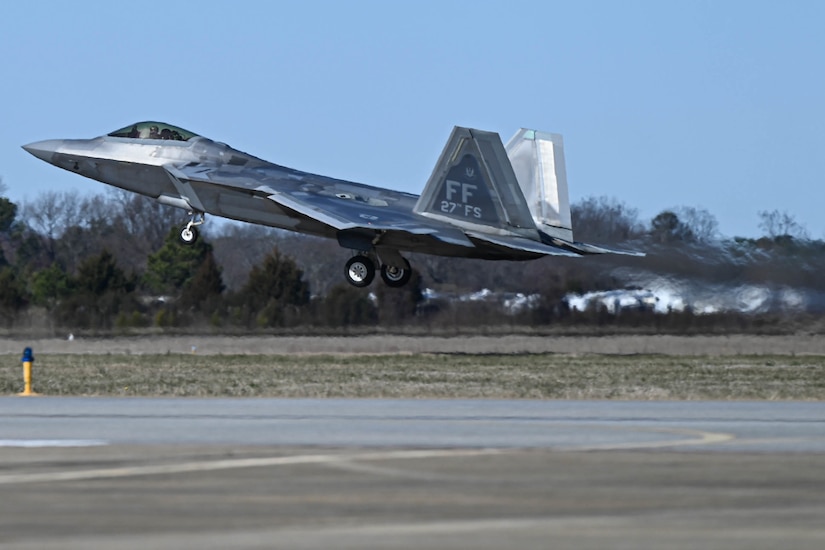 A fighter jet takes off.