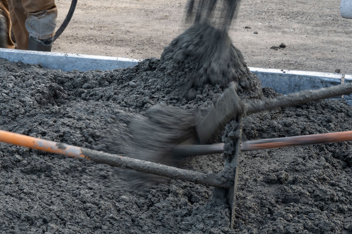 Airmen from the 819th RED HORSE Squadron out of Malmstrom Air Force Base, Montana, assist Philippine Air Force Airmen in pouring concrete as part of a Field Training Event at Basa Air Base, Philippines, January 25, 2023. This event was one of many that took place in the Philippines over the course of two weeks, which included subject matter expert exchanges on maintenance, hot pit refueling, airfield damage repair, and logistics. (U.S. Air Force photo by Tech. Sgt. Hailey Haux)