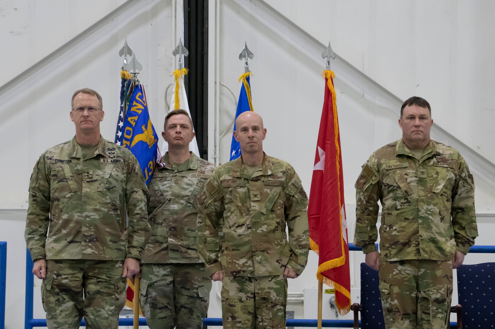 From left, Maj. Gen. Levon Cumpton, Adjutant General of the Missouri National Guard, Chief Master Sgt. Jason R. Henke, 131st Bomb Wing command chief master sergeant, Col. Matthew D. Calhoun, outgoing 131st Bomb Wing commander, and Col. Jared P. Kennish, incoming 131st Bomb Wing commander, stand ready for the passing of the guidon during a change of command ceremony at Whiteman Air Force Base, Missouri, Feb. 3, 2023. During the ceremony Col. Jared P. Kennish assumed command of the 131st Bomb Wing from Col. Matthew D. Calhoun. (U.S. Air National Guard photo by Senior Airman Kelly C. Ferguson)